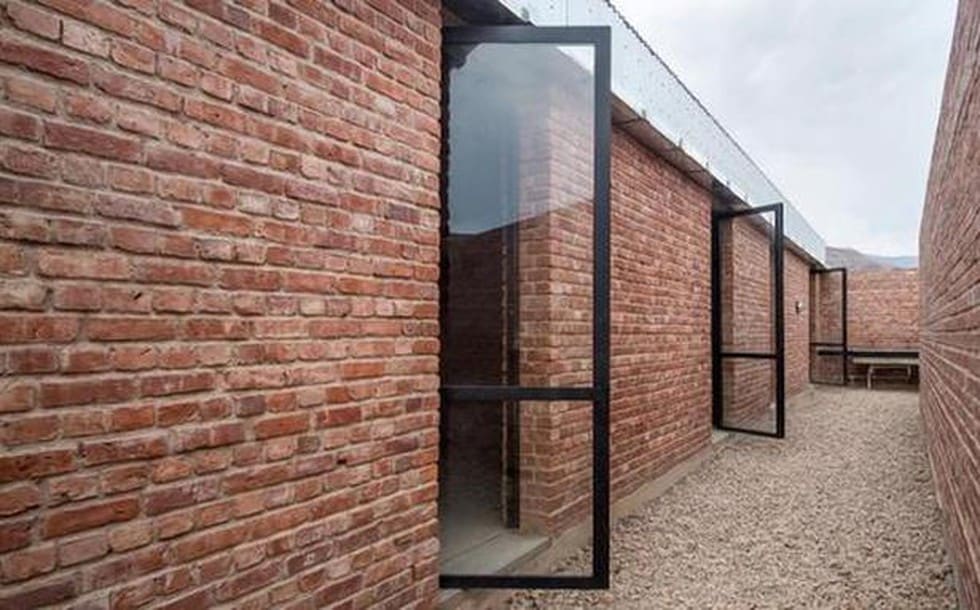 Semi-Confined Unreinforced Brick Masonry (SC-URBM)